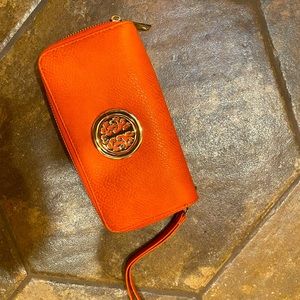 Ladies vibrant orange clutch purse like new!